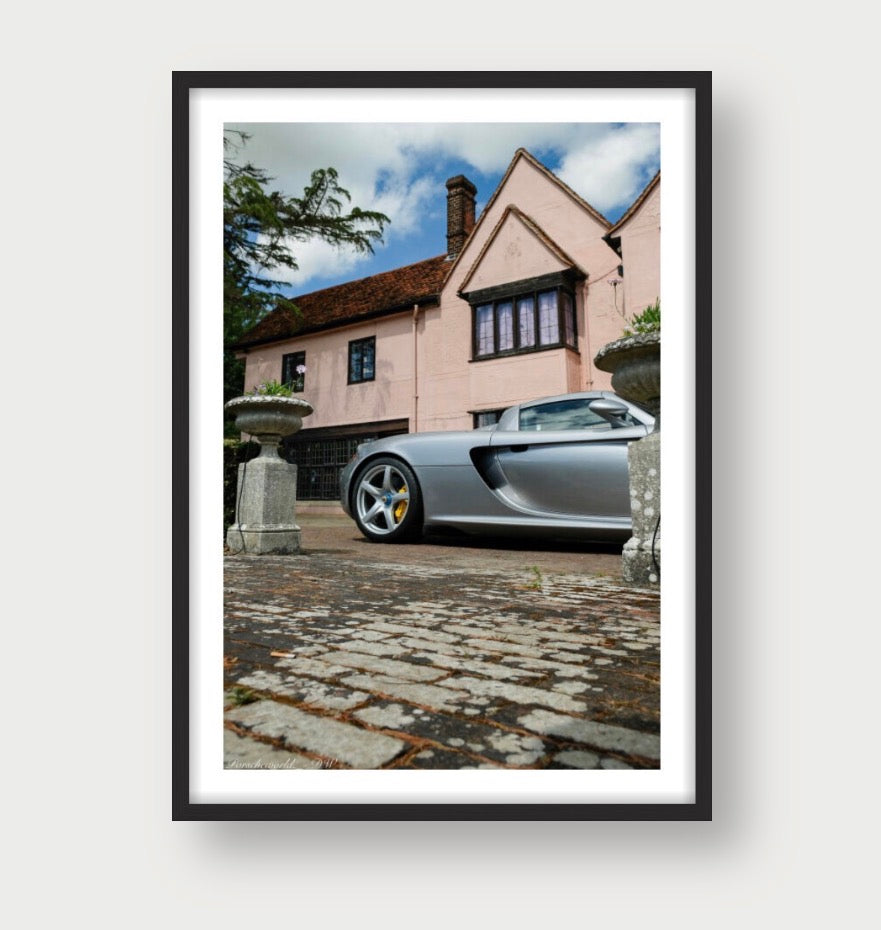 Framed Porsche Carrera GT rear view automotive print showing wheel arch and roofline at scenic event