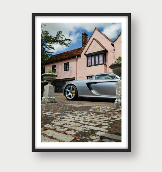 Framed Porsche Carrera GT rear view automotive print showing wheel arch and roofline at scenic event